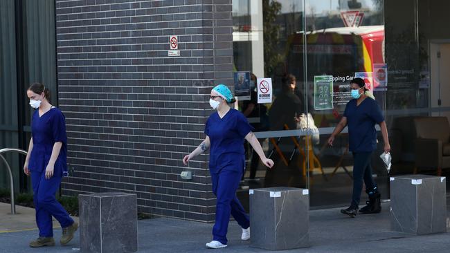 Health care workers outside the Epping Gardens Aged Care Home in Melbourne.