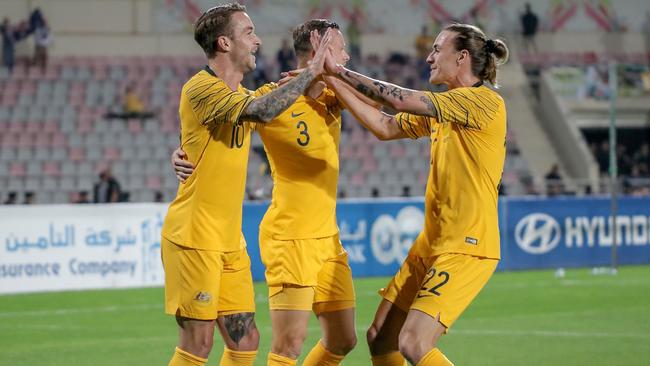 Taggart celebrates with his teammates after scoring a goal against Jordan. Picture: AFP
