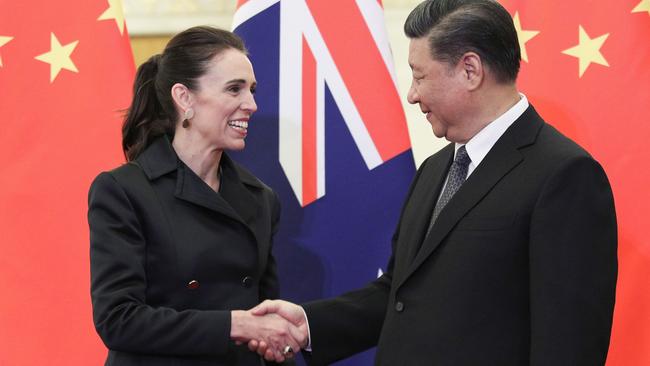 China's President Xi Jinping (R) shakes hands with Jacinda Ardern before their meeting in Beijing in 2019. Picture; AFP.