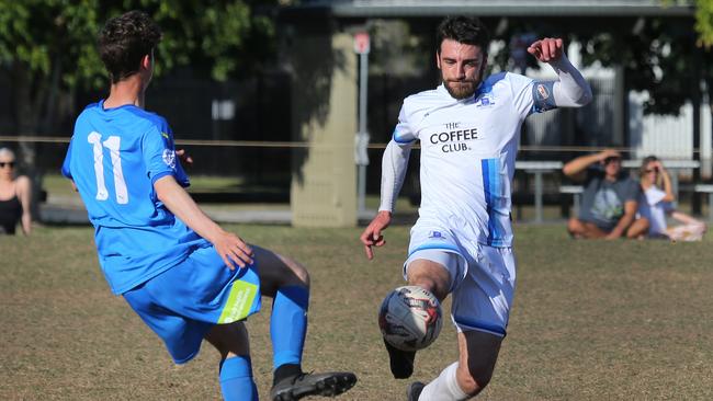 Gold Coast Premier League soccer between Surfers Paradise Apollo and Palm Beach at Surfers Paradise. Palm Beach's Jake Martin beaten to the ball by Surfers Bruno Rodriguez but kicks him in the hip.. Picture Glenn Hampson