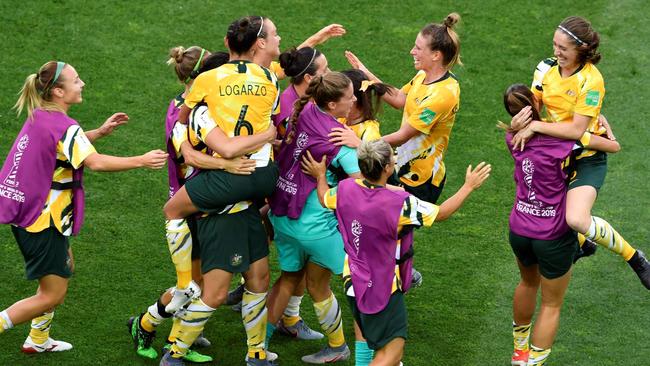 Matildas players celebrate after beating Brazil. Picture: AFP