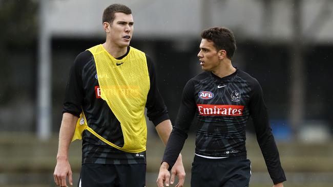 Mason Cox of the Magpies and Ash Johnson at Collingwood training.