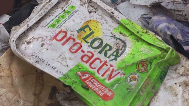 A familiar margarine packet among the mountains of rubbish in a backyard recycling facility on China.