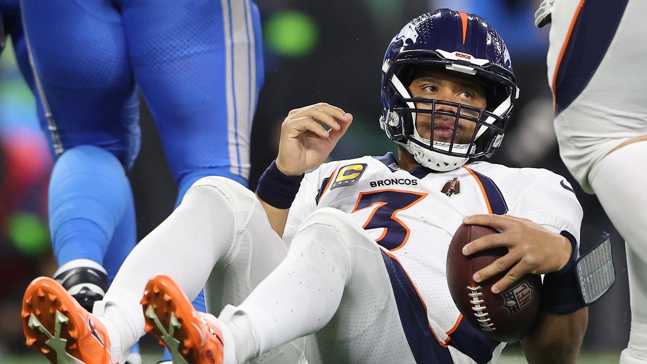 DETROIT, MICHIGAN - DECEMBER 16: Russell Wilson #3 of the Denver Broncos reacts after being sacked during the second quarter against the Detroit Lions at Ford Field on December 16, 2023 in Detroit, Michigan. (Photo by Rey Del Rio/Getty Images)
