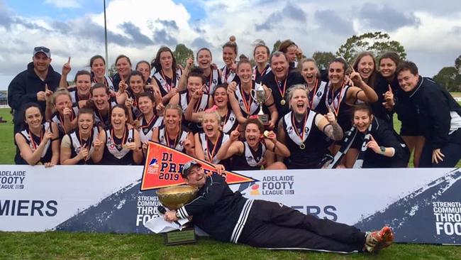 Adelaide University women’s football team celebrating after winning the 2019 division one grand final. Picture: Sue McKay