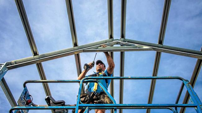 SKY HIGH: Gary Powell, subcontracting to Clarence Valley Sheds works on a new shed near Junction Hill. Picture: Adam Hourigan