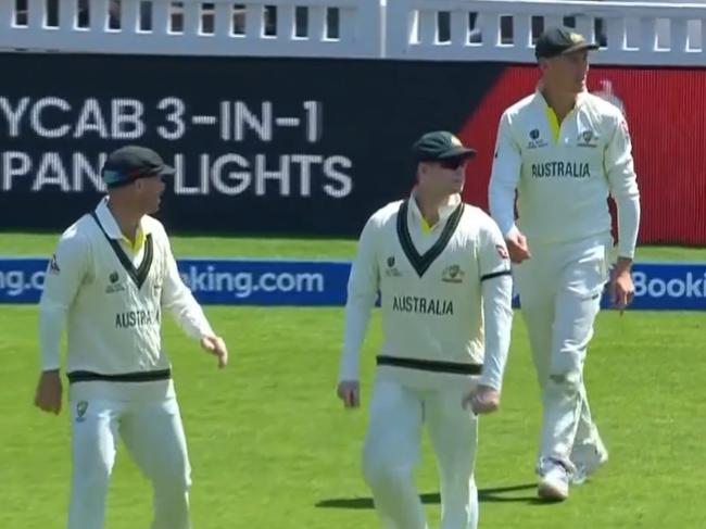 David Warner, Steve Smith and Marnus Labuschagne come back onto the field after an overturned decision during the 2023 World Test Championship Final.