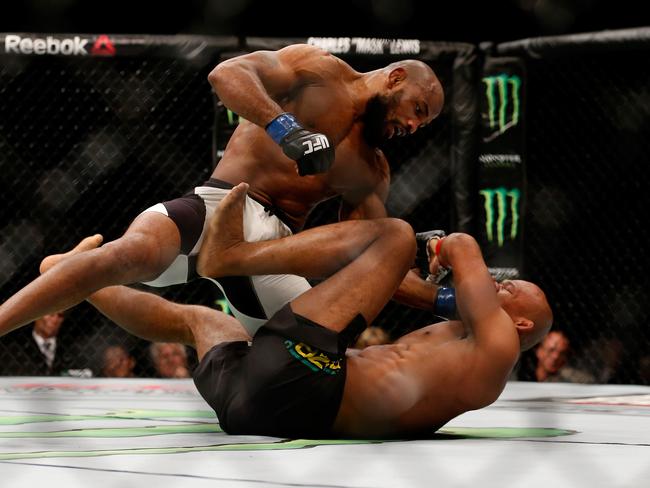 Yoel Romero punches Ronaldo 'Jacare' Souza.