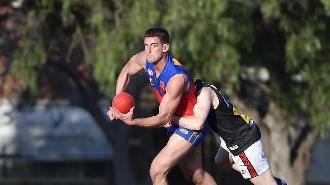 Brodie Romensky handballs. Picture: Andrew Batsch