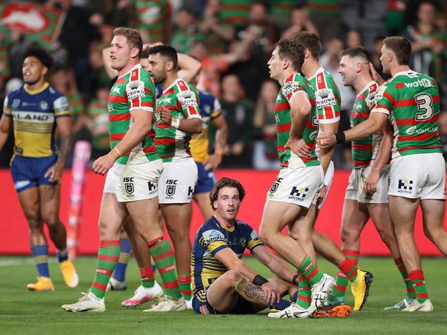 Clint Gutherson sits dejected as the Rabbitohs celebrate scoring a try. Picture: Mark Kolbe/Getty Images