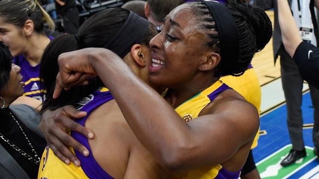Candace Parker #3 and Nneka Ogwumike #30 of the Los Angeles Sparks hug after a win in Game Five of the 2016 WNBA Finals.