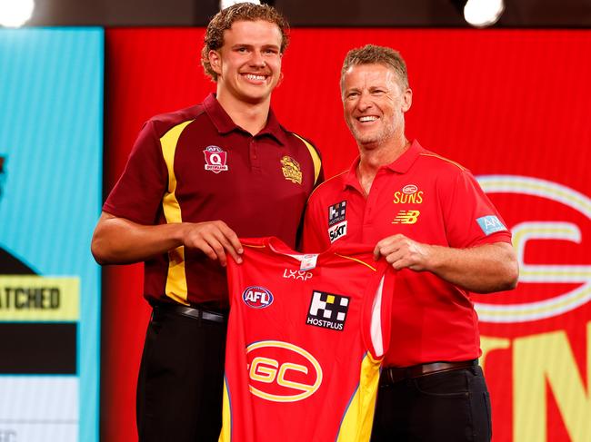 MELBOURNE, AUSTRALIA – NOVEMBER 20: Jed Walter is seen with Damien Hardwick, Senior Coach of the Suns after being selected at number three during the 2023 AFL Draft at Marvel Stadium on November 20, 2023 in Melbourne, Australia. (Photo by Michael Willson/AFL Photos via Getty Images)