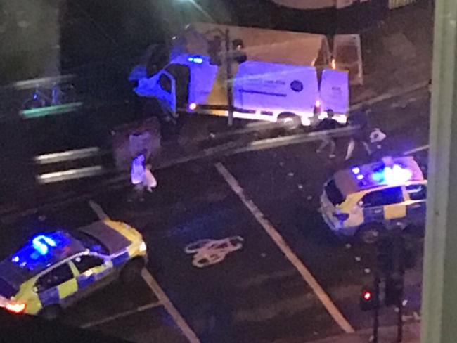 After it smashed into pedestrians on London Bridge, the van crashed outside a pub and three attackers jumped out and began stabbing people. Picture: @SkyNewsBreak