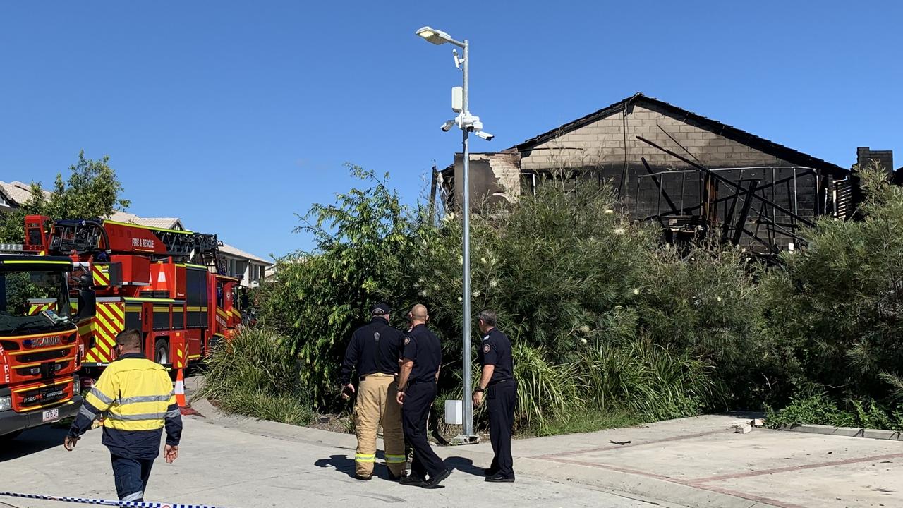 Police and firefighters at the scene of a unit fire in Browns Plains. Picture: Brad Fleet