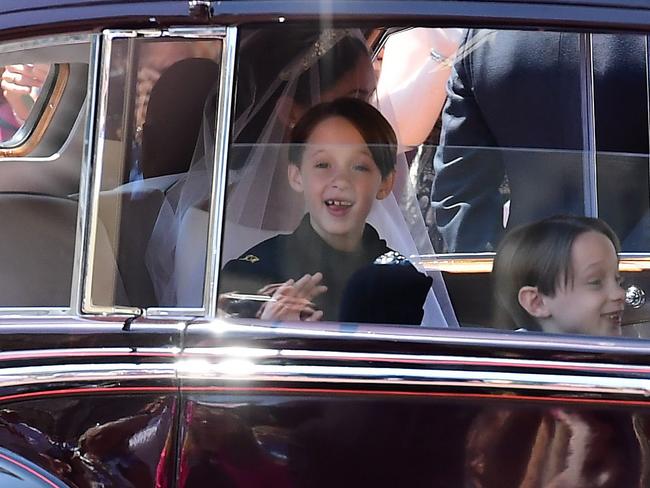 Page boys John and Brian Mulroney look excited as they arrive for the royal wedding. Picture: Ian West/AFP.