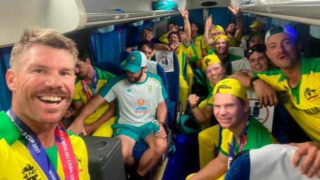 The Australian cricket team on the team bus following their historic T20 World Cup win