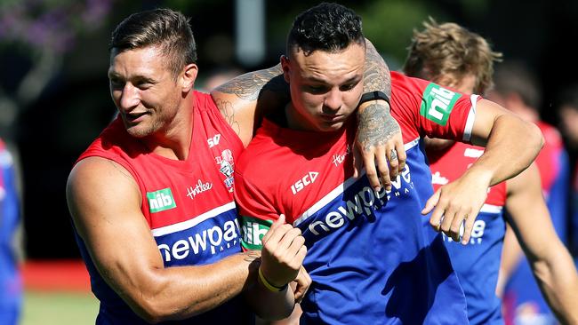 Knights co-captain Tariq Sims gives Jaelen Feeney a rough up at training. Picture: Peter Lorimer