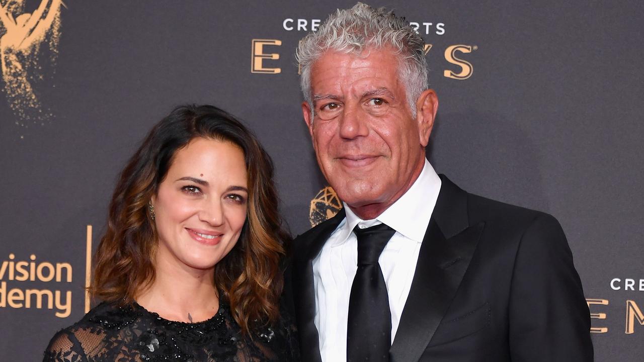 Bourdain, seen here with partner Asia Argento, had a “strange” obsession with tanning. Picture: AFP