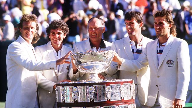 Peter McNamara, Paul McNamee, Neale Fraser, John Fitzgerald and Pat Cash celebrate victory with the Davis Cup in 1982. Picture: Tony Feder/ALLSPORT