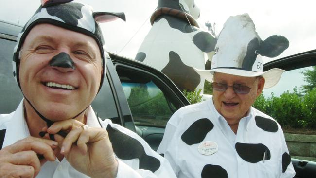 Dan Cathy, left, and his father, Chick-fil-A founder Truett Cathy, are shown in a Friday July 11, 2008 photo, as they don their "cow attire" as part of their fourth annual "Cow Appreciation Day," a day when anyone coming into a Chick-fil-A dressed in cow attire can get a free meal. This stop at the Vinings Chick-fil-A on Cumberland Parkway was one of three stops the Cathy's made today as part of the promotion. The event continues a 13-year marketing effort that began with a billboard in Dallas, TX urging customers to "Eat Mor Chikin." In an interview this week, Truett and Dan Cathy say the cow campaign is still going strong. (Andy Sharp/The Atlanta Journal-Constitution via AP)