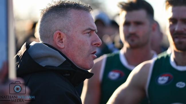 Mick Harford talks to his Greensborough players. Picture: Nathan McNeill