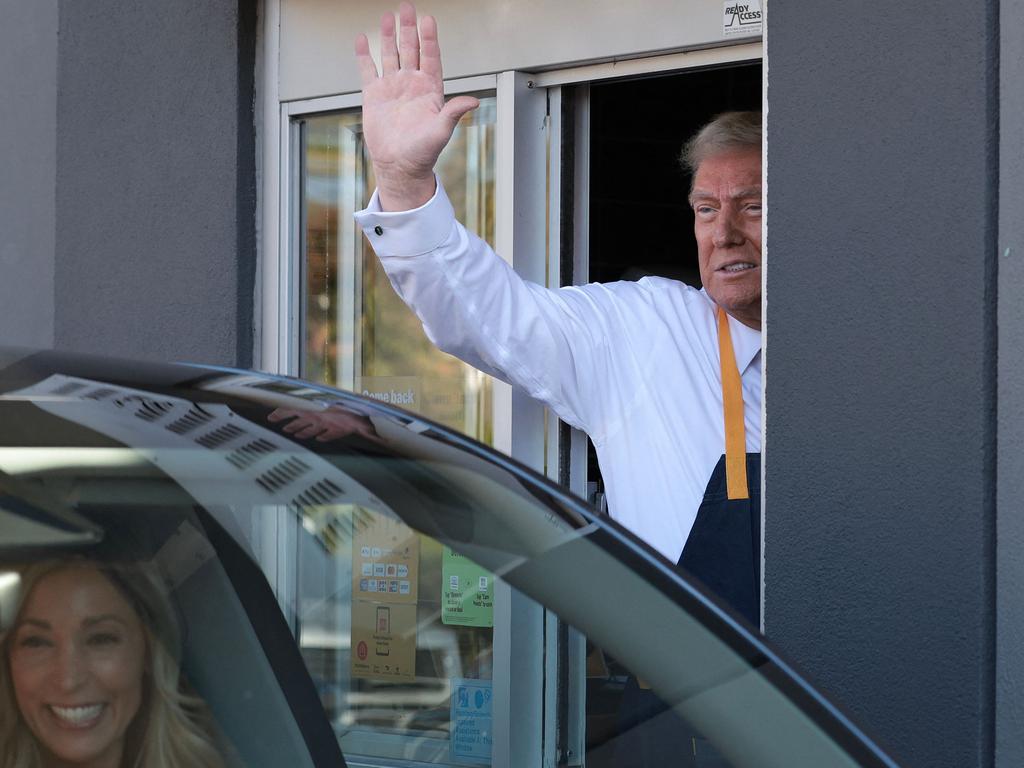 Trump waves off another happy McDonald’s customer during his shift. Picture: Win McNamee/Getty Images North America/Getty Image via AFP