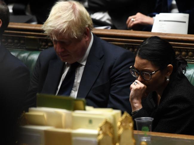 Boris Johnson and Britain's Home Secretary Priti Patel listen to tributes to murdered British MP David Amess. Picture: AFP