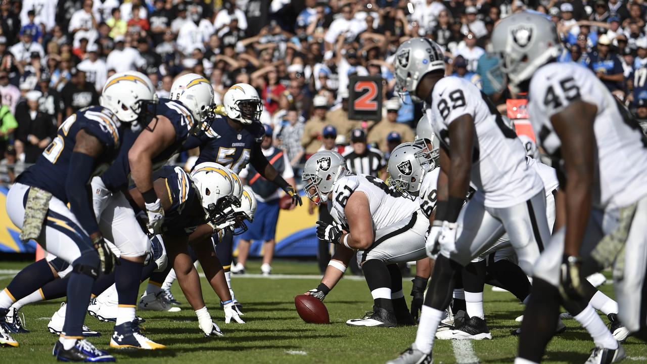 FILE - In this Sunday, Nov. 16, 2014 file photo,The Oakland Raiders and San Diego Chargers face off against each other during the second half of an NFL football game in San Diego. The Oakland Raiders and San Diego Chargers are planning a shared stadium in the Los Angeles area if both teams fail to get new stadium deals in their current hometowns. The teams announced plans for the $1.7 billion stadium in Carson in a joint statement Thursday night, Feb. 19, 2015. (AP Photo/Denis Poroy, File)