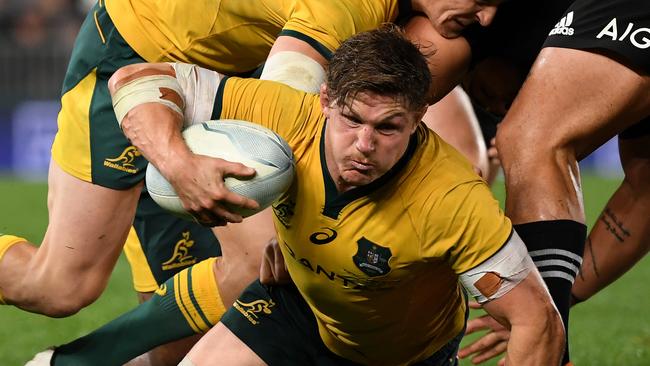 Wallabies captain Michael Hooper takes on the All Blacks at Eden Park last year.