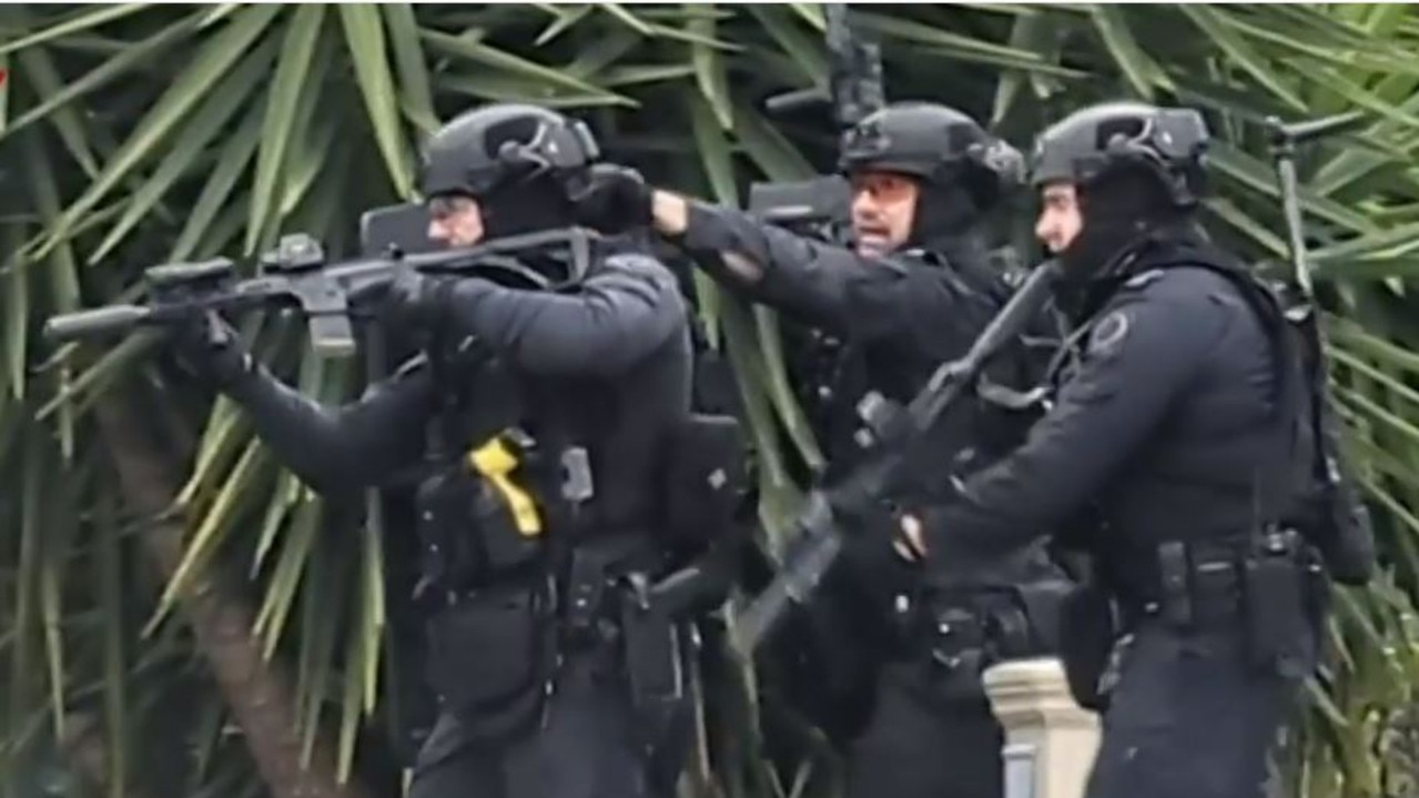 Elite star force officers swarmed the area and arrested a 51-year-old man following a tense three-hour siege. Picture: 7News
