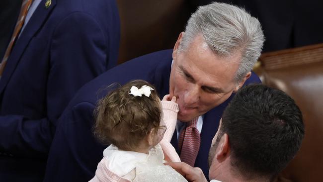 Kevin McCarthy (R-CA) plays with the daughter of Rep.-Elect Mike Lawler, Julianna, during a break as Representatives casts their votes for Speaker of the Hous. Picture: Getting Images/ AFP.