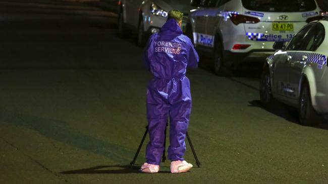 The West Pennant Hills street became a crime scene last night. Picture: Damian Hoffman