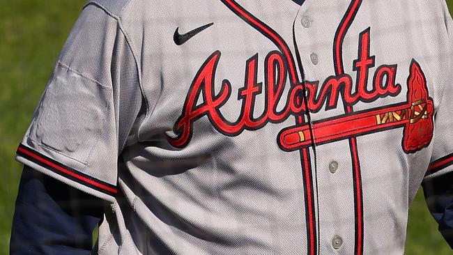 The All-Star Game logo is covered on the right sleeve of manager Brian Snitker #43 of the Atlanta Braves during a baseball game against the Philadelphia Phillies in Philadelphia, Pennsylvania. Atlanta was scheduled to be the host city of the game, but MLB Commissioner Rob Manfred announced that due to Georgia's new voting laws, the league would move it. Picture: Getty Images