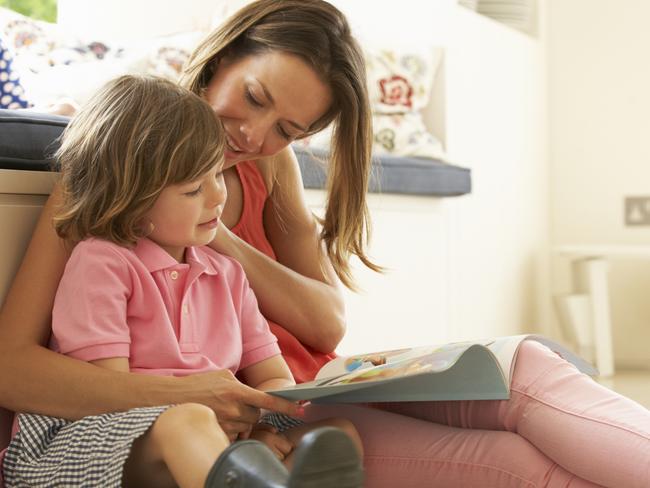 Mother caring for a child, taking care of her childmother and children, childcare, parents, stay at home mum, mother, bond between mother and child, generic, thinkstock, motherly love, working mother, woman reading with kid on her lap, reading to her child