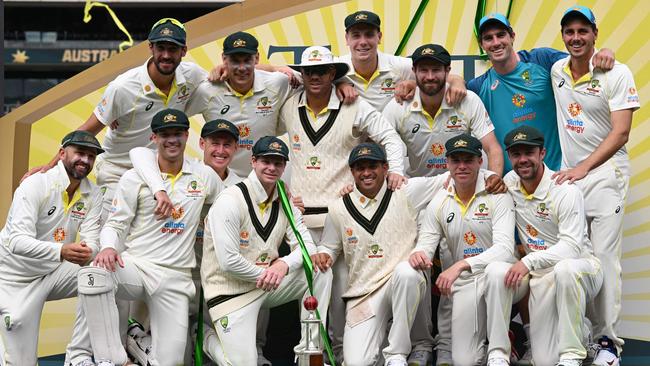 The Australian team pose with the trophy on the fourth day after winning the second cricket Test match between Australia and the West Indies at the Adelaide Oval in Adelaide on December 11, 2022. (Photo by William WEST / AFP)