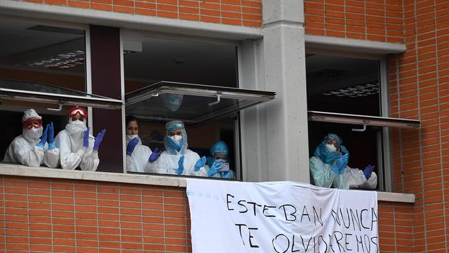 Healthcare workers applaud in memory of their co-worker Esteban, a male nurse that died of the coronavirus disease at the Severo Ochoa Hospital in Leganes, near Madrid.