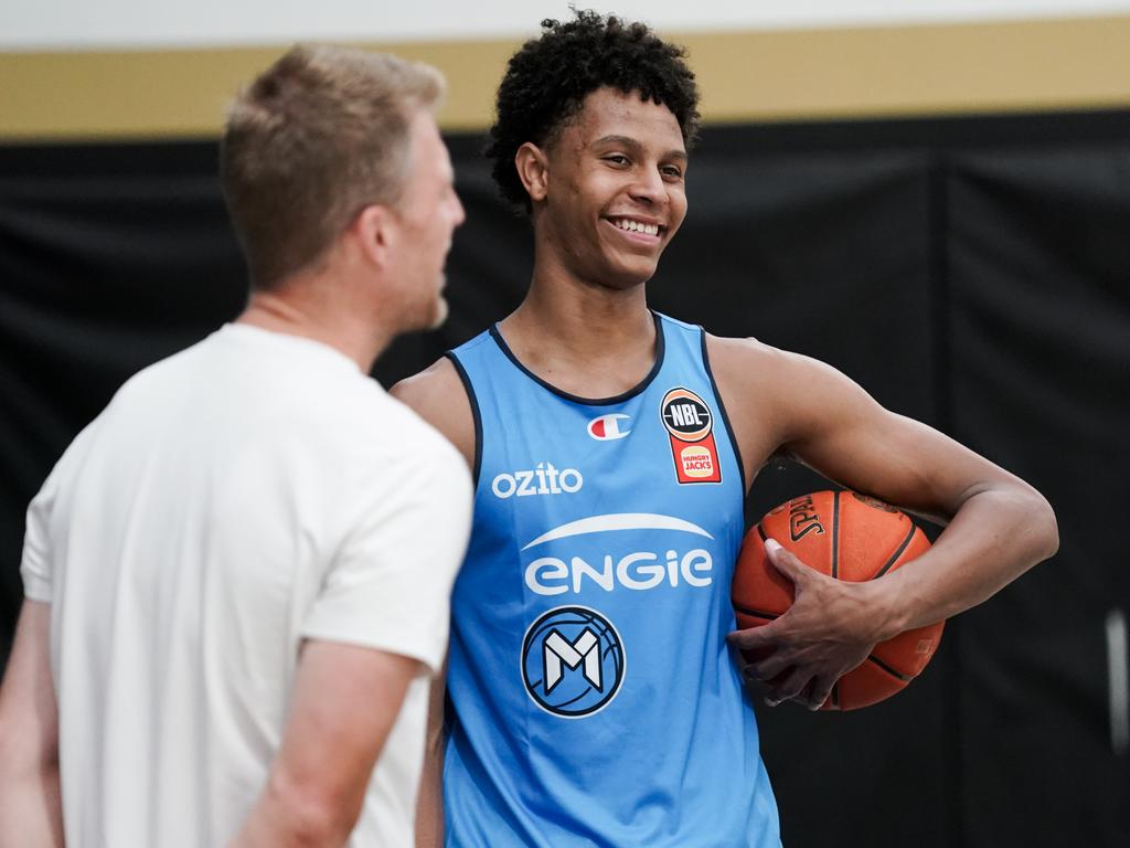 Dash Daniels shares a laugh with Melbourne United assistant Rhys Carter. Picture: Melbourne United Media