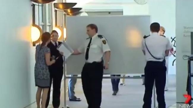 Michaelia Cash walks behind a whiteboard as she arrives at Senate estimates. Picture: Seven News.