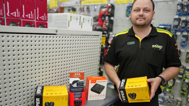 Chris Coombs from Autobarn Cairns holding their stock of engine immobilisers. Picture: Nuno Avendano