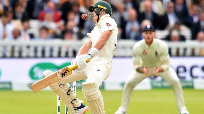 Marnus Labuschagne reacts as the ball, bowled by England's Jofra Archer hits him on the helmet during play on the fifth day of the second Ashes cricket Test match.