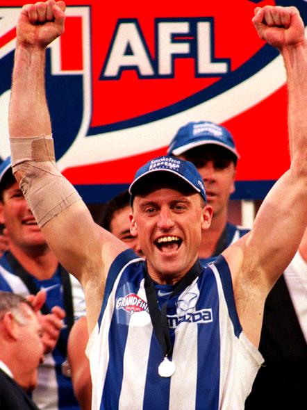 John Longmire celebrates North Melbourne’s 1999 premiership.