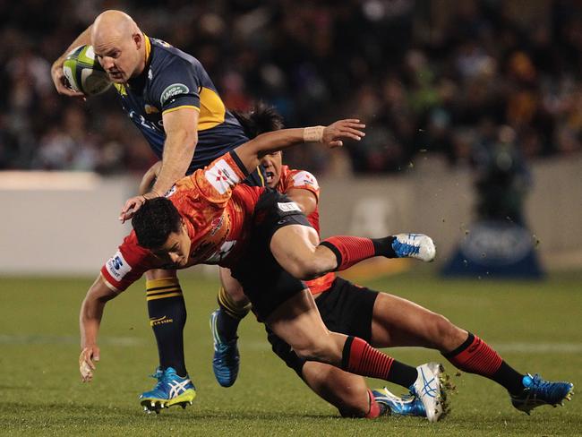 CANBERRA, AUSTRALIA - MAY 28: Stephen Moore of the Brumbies is tackled during the round 14 Super Rugby match between the Brumbies and the Sunwolves at GIO Stadium on May 28, 2016 in Canberra, Australia. (Photo by Stefan Postles/Getty Images)