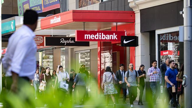 Pedestrians walk past a Medibank store in Sydney last year. Picture: NCA NewsWire / Christian Gilles