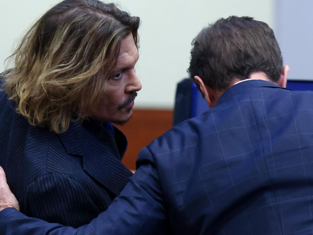 Depp was pictured laughing at his childhood friend during the testimony. Picture: EVELYN HOCKSTEIN/AFP