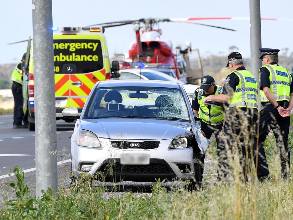 Police examine the scene where Kieran Modra was struck and died on the Sturt Highway, near Argent Rd, Kingsford, north of Adelaide on Wednesday. Picture: AAP / Keryn Stevens