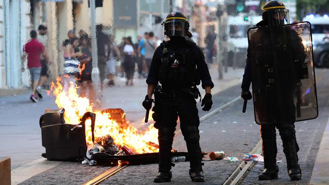 French riot police by a burning bin in Marseilles. Picture: AFP