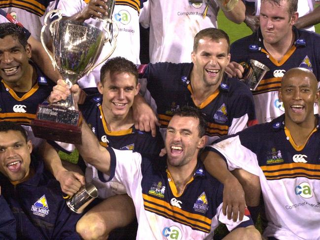 MAY 26, 2001 : ACT Brumbies team with trophy celebrate victory over the Coastal Sharks after the grand final of the Super 12 RU game at Bruce Stadium, Canberra, 26/05/01. Pic John Feder. Rugby Union