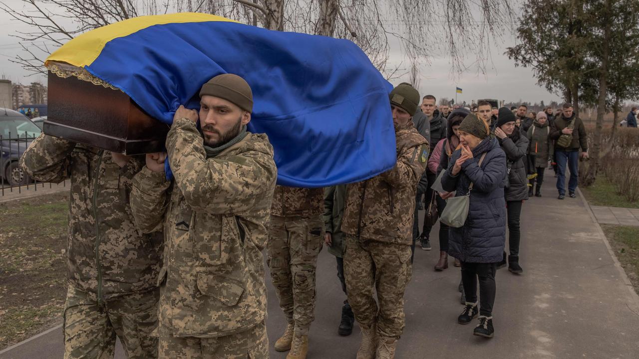 Ukrainian soldiers carry the coffin of late Ukrainian serviceman Andriy Katanenko, 39, who was killed near Avdiivka, which has fallen to the Russians. Picture: AFP