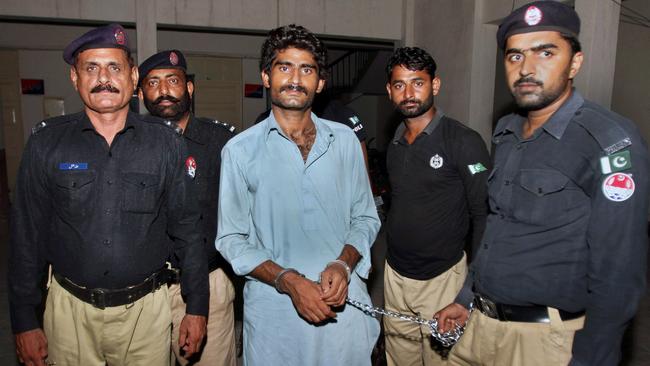 Pakistani police officers present Waseem Azeem, the brother of slain model Qandeel Baloch, before the media following his arrest at a police station in Multan, Pakistan.