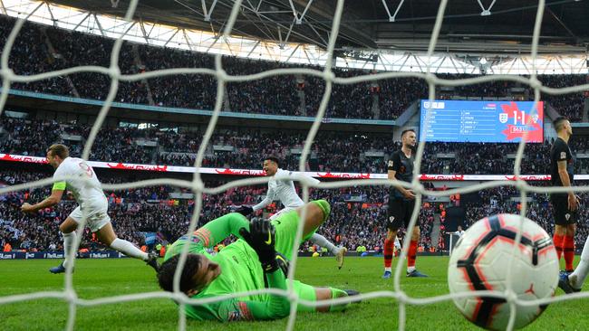 England striker Harry Kane, left, celebrates after scoring a late winner against Croatia at Wembley. Picture: AFP